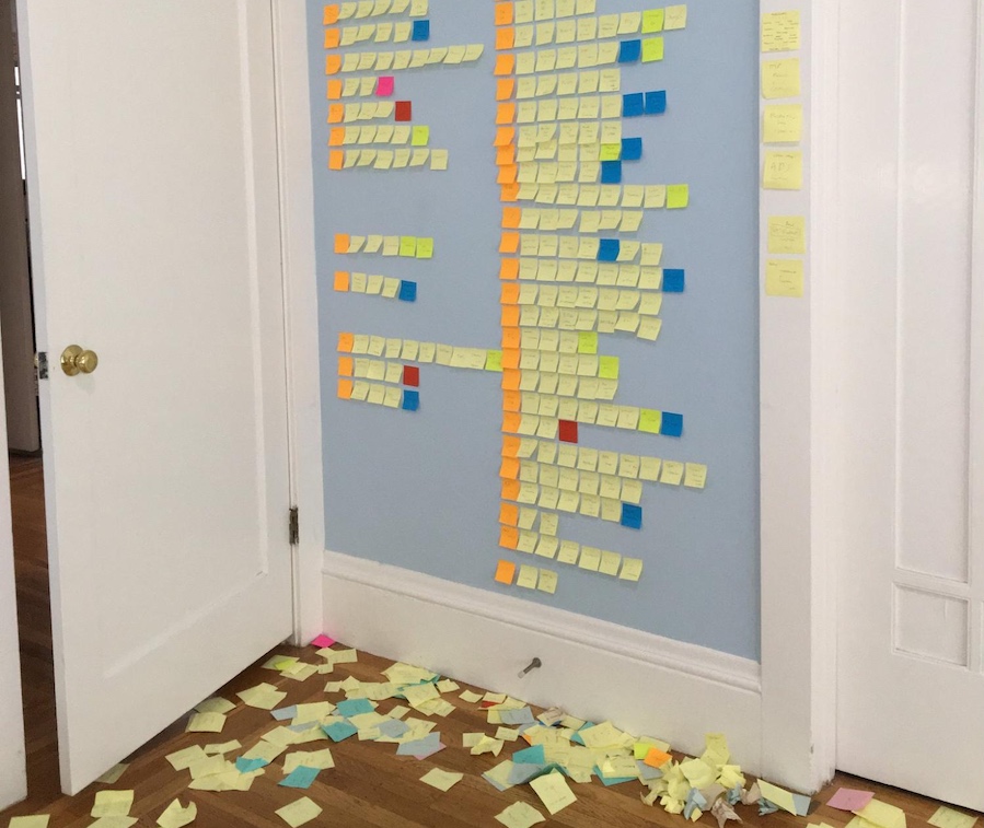 Marcin Wichary uses post-its on a wall for the thinking step of developing his book on the history of keyboards.