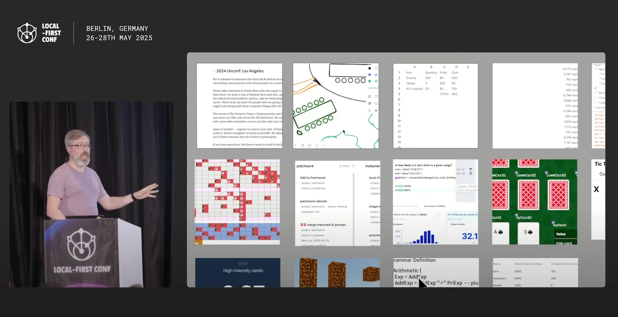 A still frame from Peter's talk, showing him at a podium gesturing toward a large screen full of tools and documents created with Patchwork.